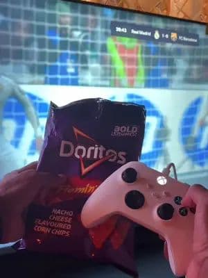 FIFA on. Controller in one hand, Flamin’ Hot loaded nachos in the other. This is what peak game night looks like. ❤️ Wo